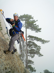 Climbing photographer Simon Carter at work photographing the first ascent of the West Peak of Mt Huashan, China. Photo Leo Houlding,