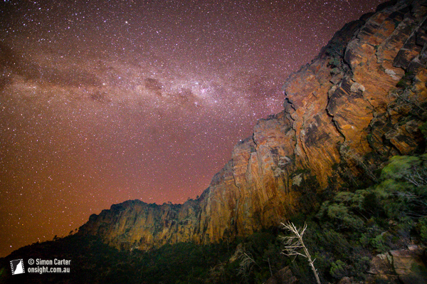 Sleeping out under the stars at Top Camp, the stars seem, well, so bright! 30 second exposure with cliffs painted by headtorches.